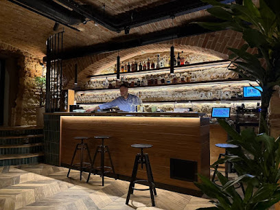This is Wine Bar PODRUM 1879 caffe and wine's logo